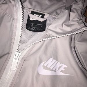 white and light grey nike wind breaker